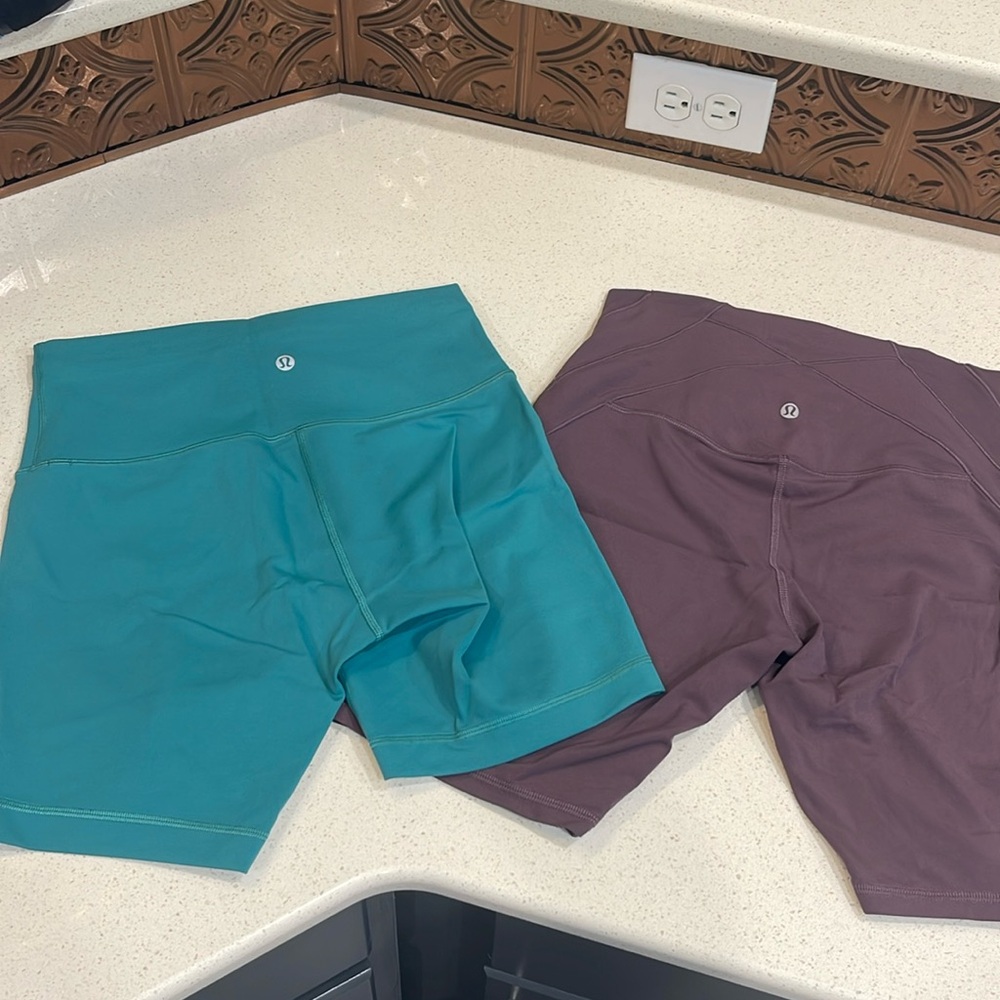 Lululemon biker shorts. Sz 8. Excellent condition.  Pair of Teal & Purple.